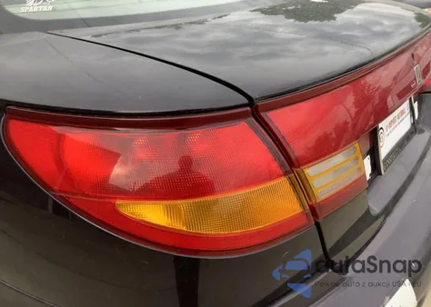 1999 Saturn Sc1 z USA, uszkodzony, nr VIN 1G8ZP1283XZ324457